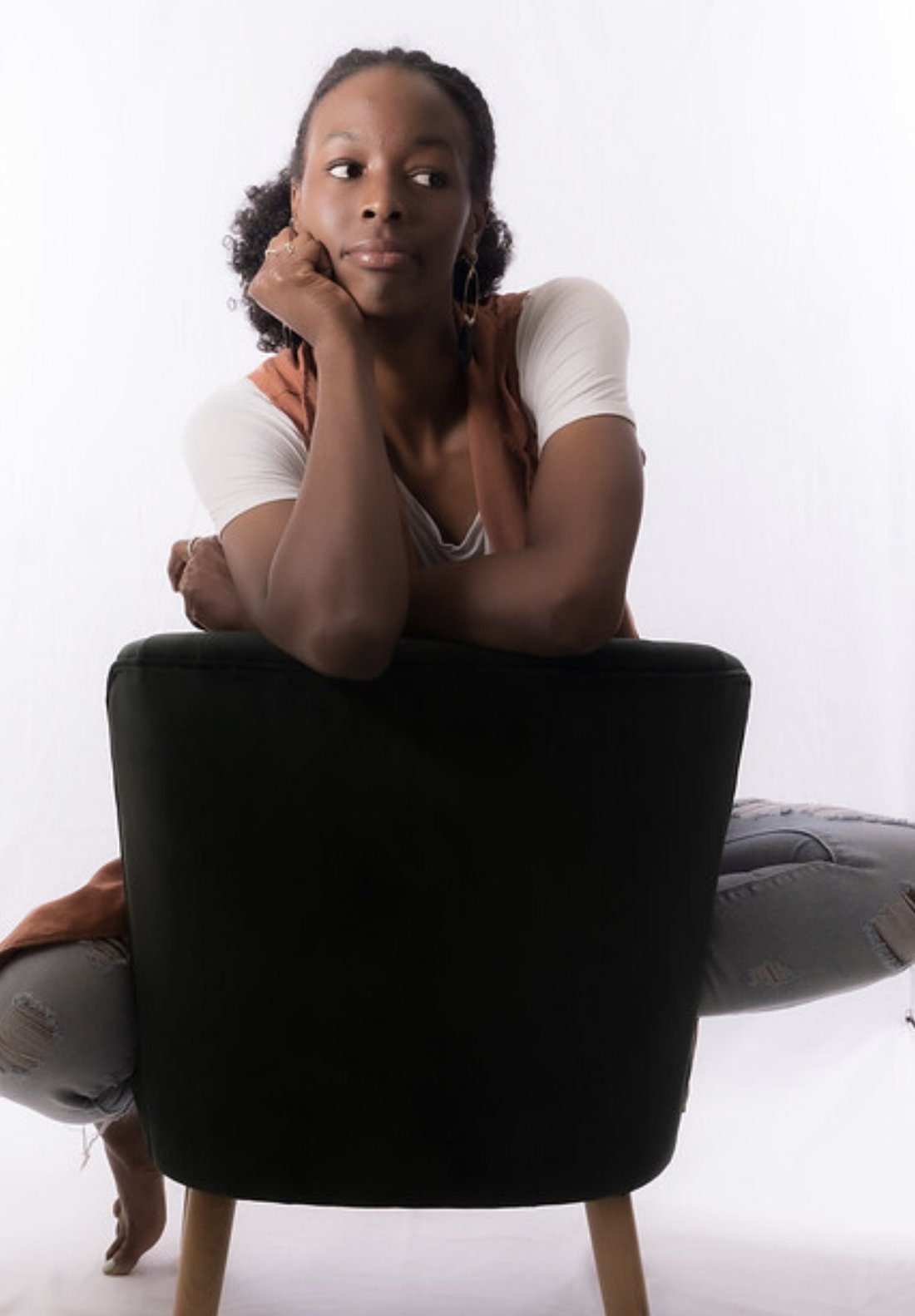 Simone Deloach in a quiet, thoughtful studio portrait